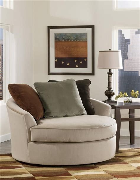 It is spacious enough to create a good environment for heavenly cuddling, rocking the baby to slumber, or even storytelling. Signature Design by Ashley - Oversized Round Swivel Chair ...