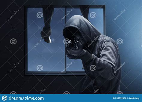 Criminal Man In Hidden Mask Pointing The Shotgun While Robbery The