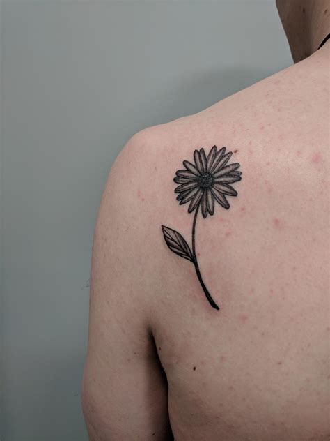 The other flower that is often combined with daisies tattoo is the rose. Daisy tattoo by Adriana Malliarou @ Lucky's in Cambridge ...