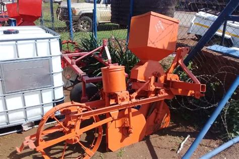 A garden picture at the nursery we have a number of really old trucks. Massey Ferguson one row planter for sale Drawn planters ...