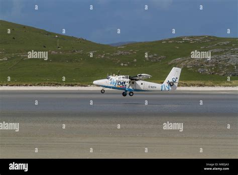 Dhc Twin Otter Passenger Aeroplane Taking Off From The Beach Runway At