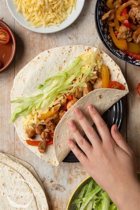 A classic mexican recipe, juicy chicken is seasoned, seared and cooked to perfection, then tossed with sauteed bell peppers and onions. Mild chicken fajitas for kids - A Mummy Too