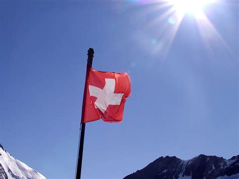 The switzerland flag is a red square with a bold, equilateral white cross in the center. Flag Switzerland | Free Stock Photo | Swiss flag | # 17867