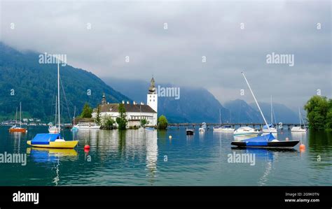 Orth Castle On Lake Traun In Gmunden And Boats In The Water Upper