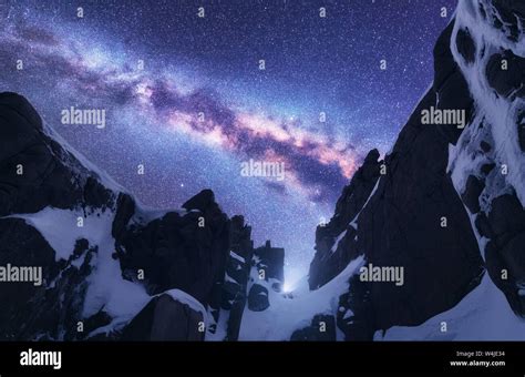 Milky Way And Snowy Mountains At Starry Night Stock Photo Alamy