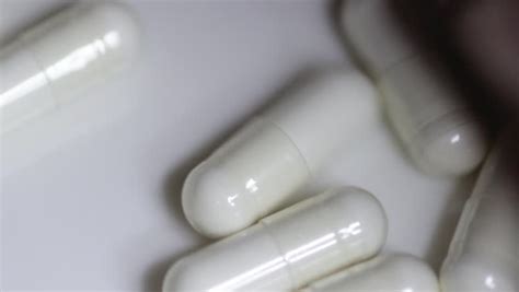 It consists of a reusable booster and a capsule on the crew member's first initials and surnames are printed in white letters on the chest area of the suits, which have black trim and the blue origin name. White Capsule Pills Filled with Stock Footage Video (100% ...