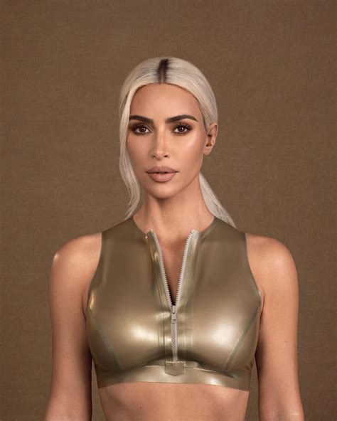 Kim Kardashian Shows Off Her Tiny Arms Waist In Gold Crop Top As Fans