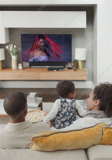 Family watching TV on living room sofa - Stock Image - F032/5591 ...