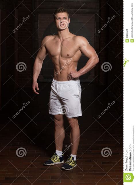 Healthy Young Man Flexing Muscles Stock Image Image Of Ethnicity