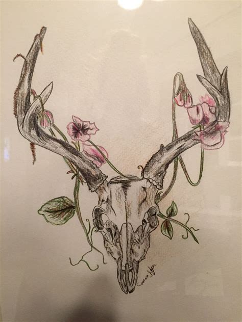 A Drawing Of A Deer Skull With Flowers On It