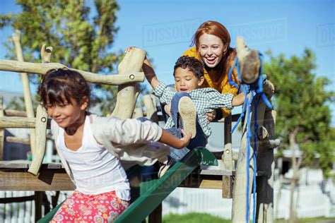 Teacher And Students Playing On Playground Stock Photo Dissolve
