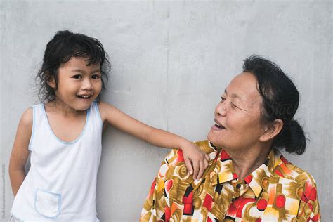asian grandmother and her granddaughter by stocksy contributor chalit saphaphak stocksy