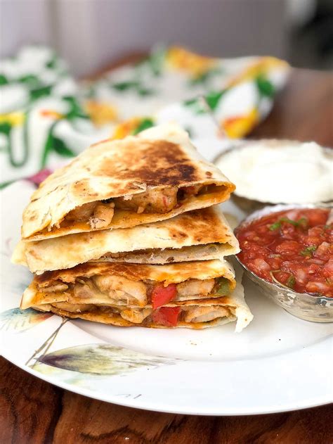 This recipe combines chicken and cheese with seasoning and veggies! Chilli Chicken Cheese Quesadilla Recipe by Archana's Kitchen