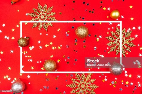 Festive Red Background With Gold And Silver Stars And Christmas Balls