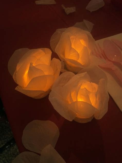 All sizes are approximate measurements. Electric Tea lights with silk flower petals taped on ...