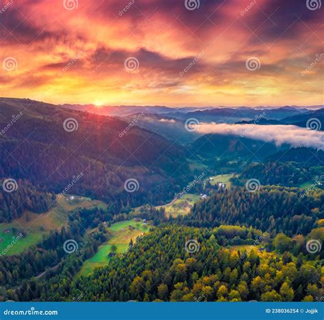 Spectacular Sunrise On Carpathian Mountains Fog Spreads On The Valley