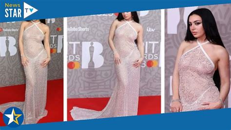 Charli XCX bares all in very risqué see through dress at Brit Awards