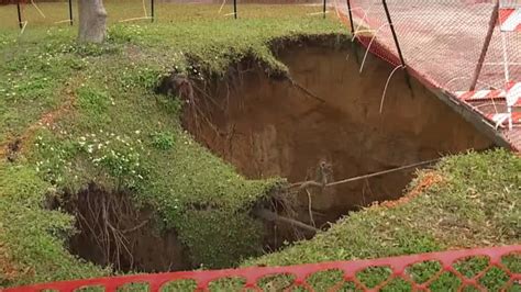 Massive Sinkhole 70 Feet Deep And Still Growing Appears On Florida Lawn