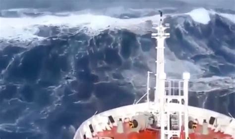 A tsunami is a series of waves in a water body caused by the displacement of a large volume of water, generally in an ocean or a large lake. Ship slammed by monster waves in violent mega storm at sea ...