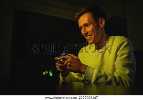 Young Man Excitedly Playing Console Game Stock Photo 2222002167