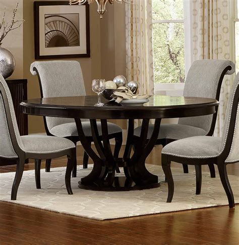 This butterfly leaf is such a better idea. Homelegance Savion Round/Oval Dining Table with Leaf ...