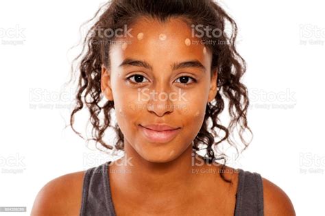 A Young Dark Skinned Woman Spots Of Liqud Foundation On Her Face Stock