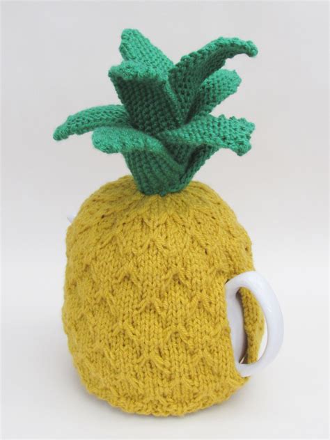 Knit an adorable sweater for your favorite hot or cold beverage. Pineapple tea cosy knitting pattern