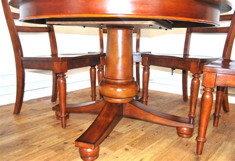 Pull the leg to the side to drop down the table half. Round Dining Table with Leaf Extension | Mary Kay's Furniture