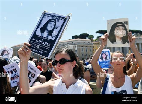 People hold placards with Emanuela Orlandi's portrait during Pope