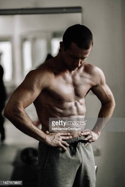 Skinny Man Flexing Muscles Photos And Premium High Res Pictures Getty