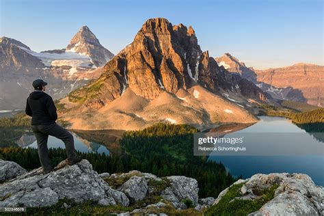 Woman Looking Out Over Mt Assiniboine Provincial Park At Sunrise High