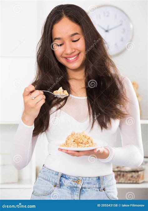 Girl Eating Useful Mixture Of Cereals Stock Photo Image Of Indoors