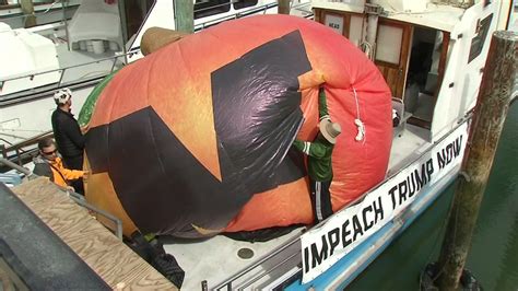 Critics Of President Trump Fly Peach Shaped Balloon Over Fishermans