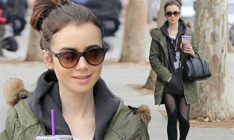 Lily Collins Flashes Her Trim Thighs In Sheer Leggings Daily Mail Online