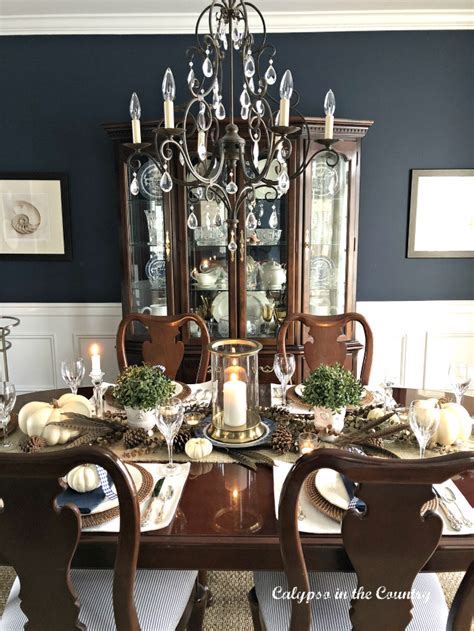 You are taking the thanksgiving table outdoors, so why not let nature be the source of inspiration that shapes its style and overall appeal? Thanksgiving Table Setting in a Navy Dining Room - Calypso ...