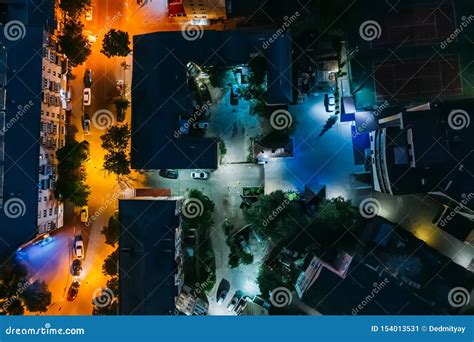 Top Down View Of Night City Buildings Yards And Streets Aerial Shot