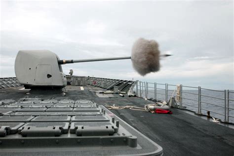A 54 Caliber Mk 45 Five Inch Gun Fires A Projectile Off The Ship S