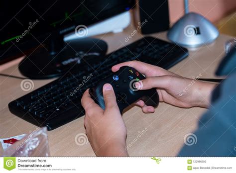 Young Boy Playing On Xbox One Video Game On Personal Computer