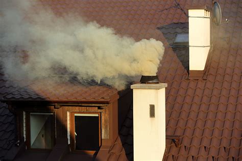 Smoke Coming Out Of The Old Chimney House Stock Photo Download Image