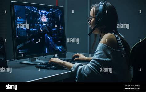 Beautiful Professional Gamer Girl Playing In First Person Shooter
