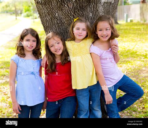 Children Group Friend Girls Playing On Tree Stock Photo