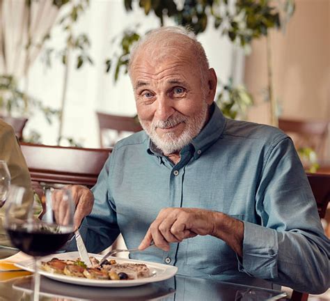Old Man Eating Banco De Fotos E Imágenes De Stock Istock