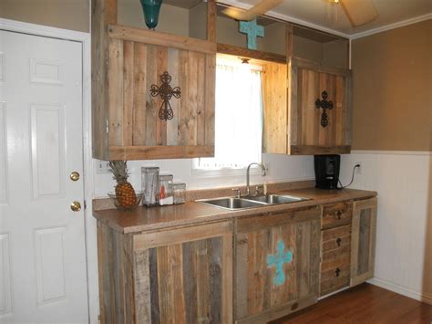 Kitchen cabinets are made of wood. cabinet reface from recycled pallets...we spent less than ...