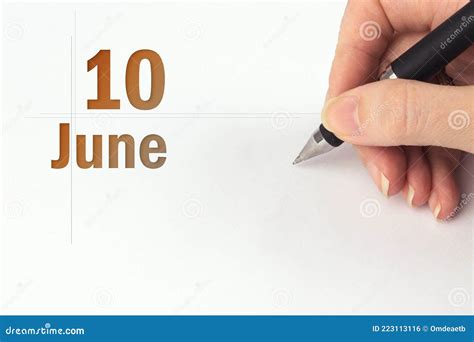 June 10th Day 10 Of Month Calendar Date The Hand Holds A Black Pen