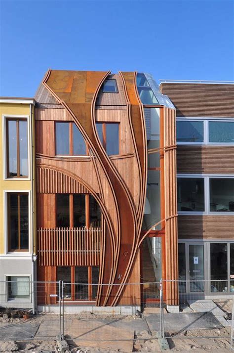 Modern Townhouse Designs With Wood Touches In Art Nouveau Style