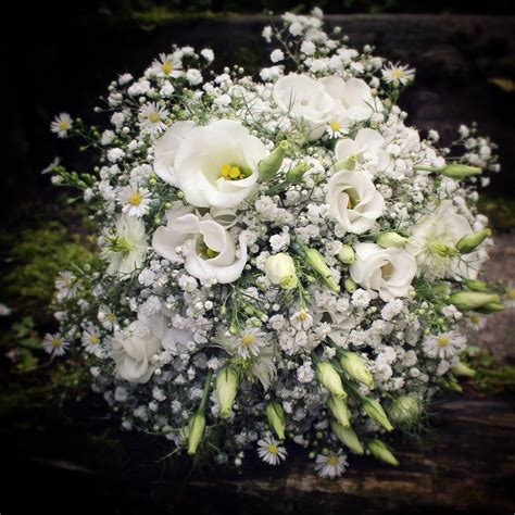 simple white wedding bouquet gypsophila daisies lisianthus nigella beautiful wedding