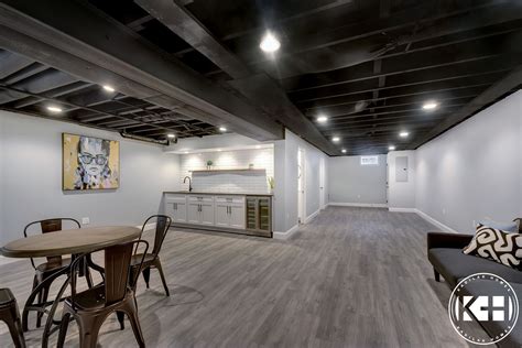 Basement ideas ceiling ideas the basement is quite possibly the most overlooked, if not openly disregarded, part of one's home. Finished basement with wet bar, babylon gray quartz ...