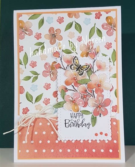 A Handmade Birthday Card With Flowers And A Butterfly On The Front