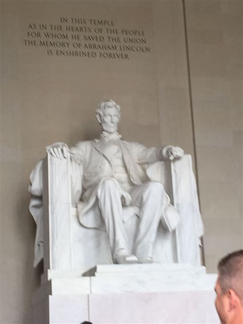Inside Abraham Lincoln Is Sitting In A Chair And They Are Huge On One