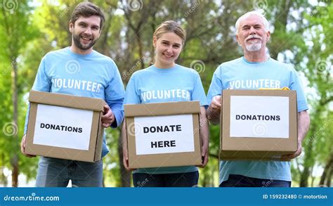 Happy Volunteers Holding Donation Cardboxes Humanitarian Aid